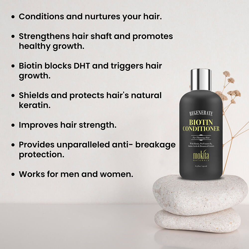 Biotin conditioner bottle on stones with text about hair benefits